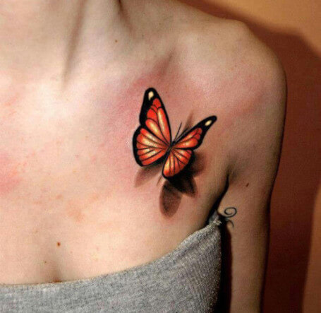 tatuaje mariposa 3D naranja pecho clavicula logia barcelona
